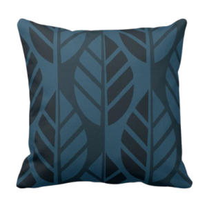 Blue throw pillow with leaves pattern