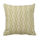 brown throw pillow with leaves pattern