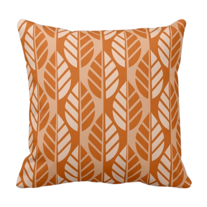 orange throw pillow with leaf pattern