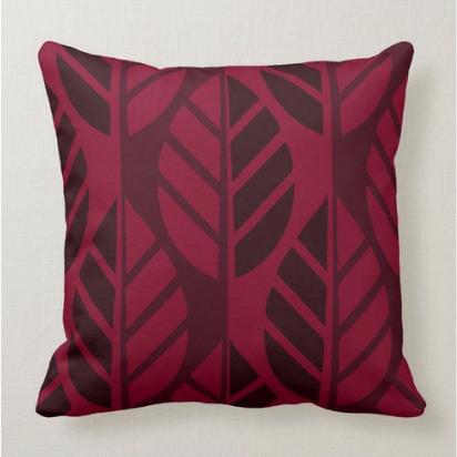 Throw pillow with red leaf pattern