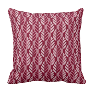 Throw pillow with red leaf pattern