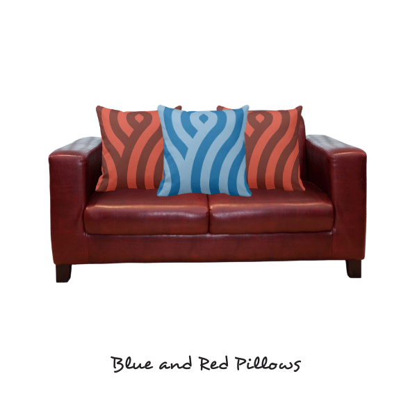 blue and red pillow on red loveseat