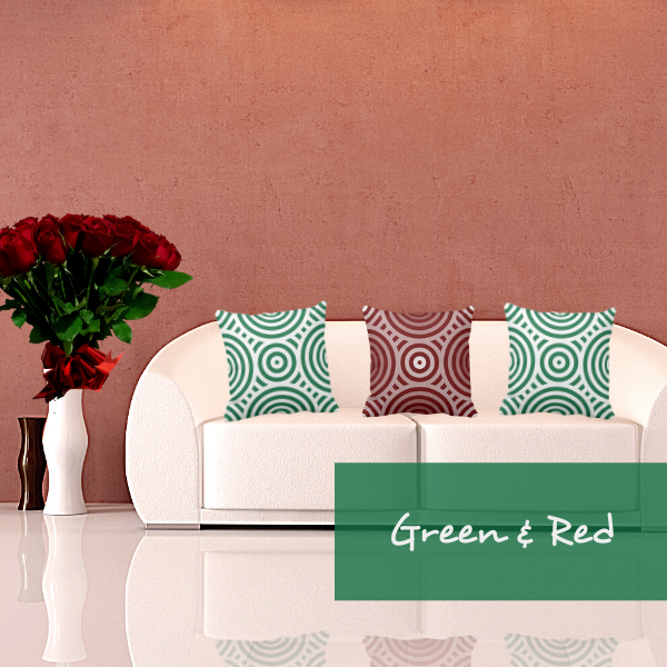 green and red pillows with circular pattern on white couch