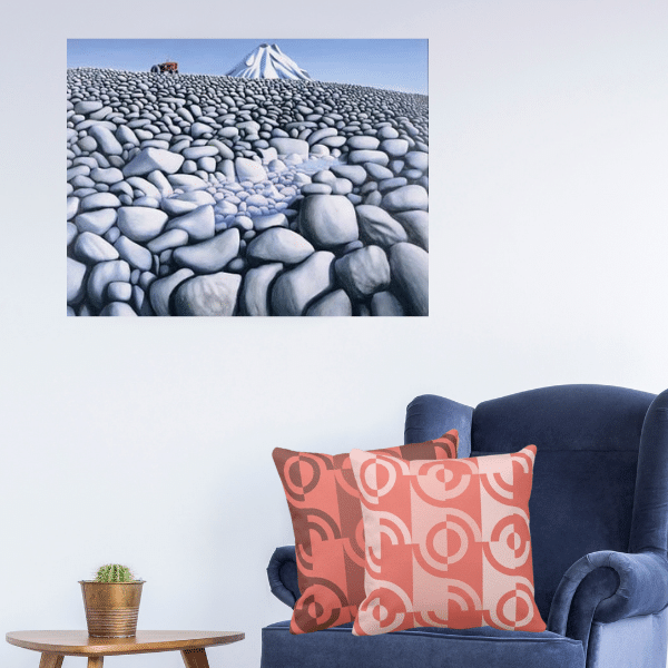 Rocks With Mountain By NewZealand Artist Michael Smither decorating a living-room cornerwith a blue armchair and two pink throw pillows showing a fragmented circle pattern