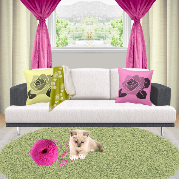 Pink and yellow pillows with rose pattern decorating a couch in charcoal and off-white.