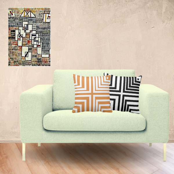 Cote de Provence art print by Paul Klee and pillows with cornered pattern in orange, white, and black