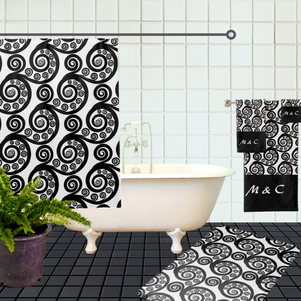 Classy black and white swirls bathroom decor idea, consisting of a shower curtain, bath mat, and towel set.