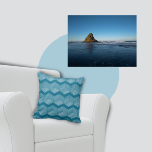 Blue pillow with diamond pattern and acrylic print withseascape