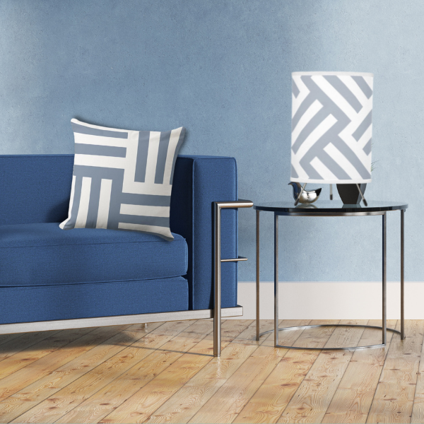 tripod lamp in blue and white complemented with a throw pillow