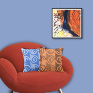 Crevasse digital art print meets a set of two blue and orange pillows