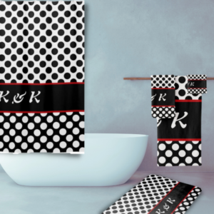 Bathroom theme with polka dot pattern and initials in black and white