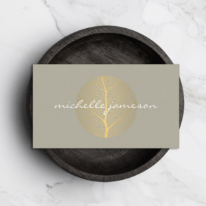 Elegant Gold Leaf Logo on Tan Business Card